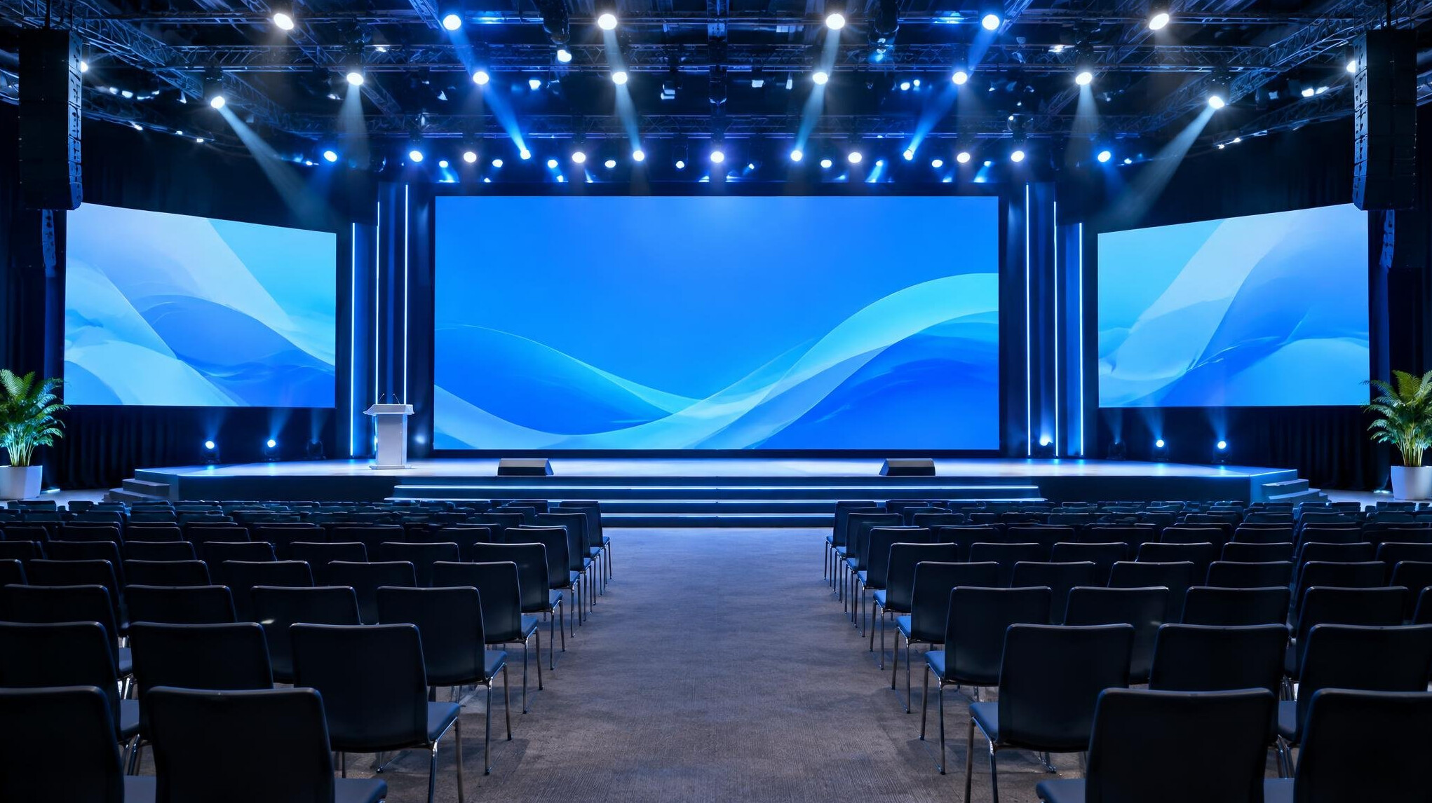 Stage with lights and screens at a conference event