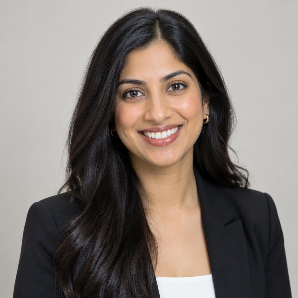 Portrait of a young woman with long dark hair smiling